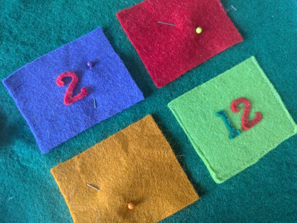 5 Uses for Felt Iron-On Advent Calendar Numbers colourful advent calendar panel for sewing