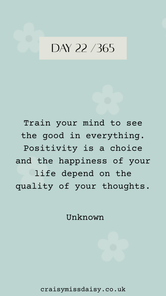 Blue-green graphic featuring a typewriter quote about training your mind for positivity for Day 22/365.