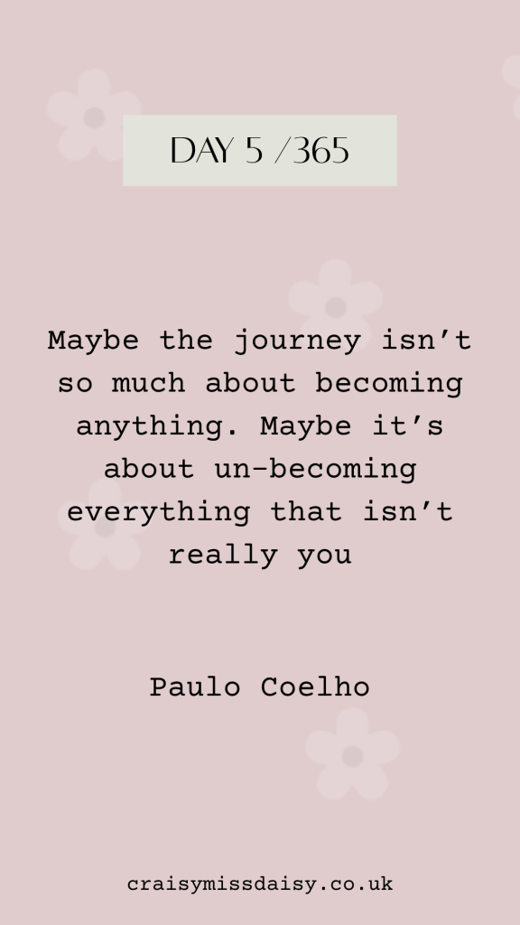 Vertical graphic on rose pink with daisies. Top box reads DAY 5/365 over a typewriter quote by Paulo Coelho about the journey of un-becoming.