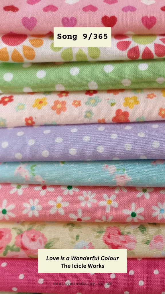 Stack of colorful patterned craft fabrics for Song 9/365, "Love is a Wonderful Colour" by The Icicle Works.